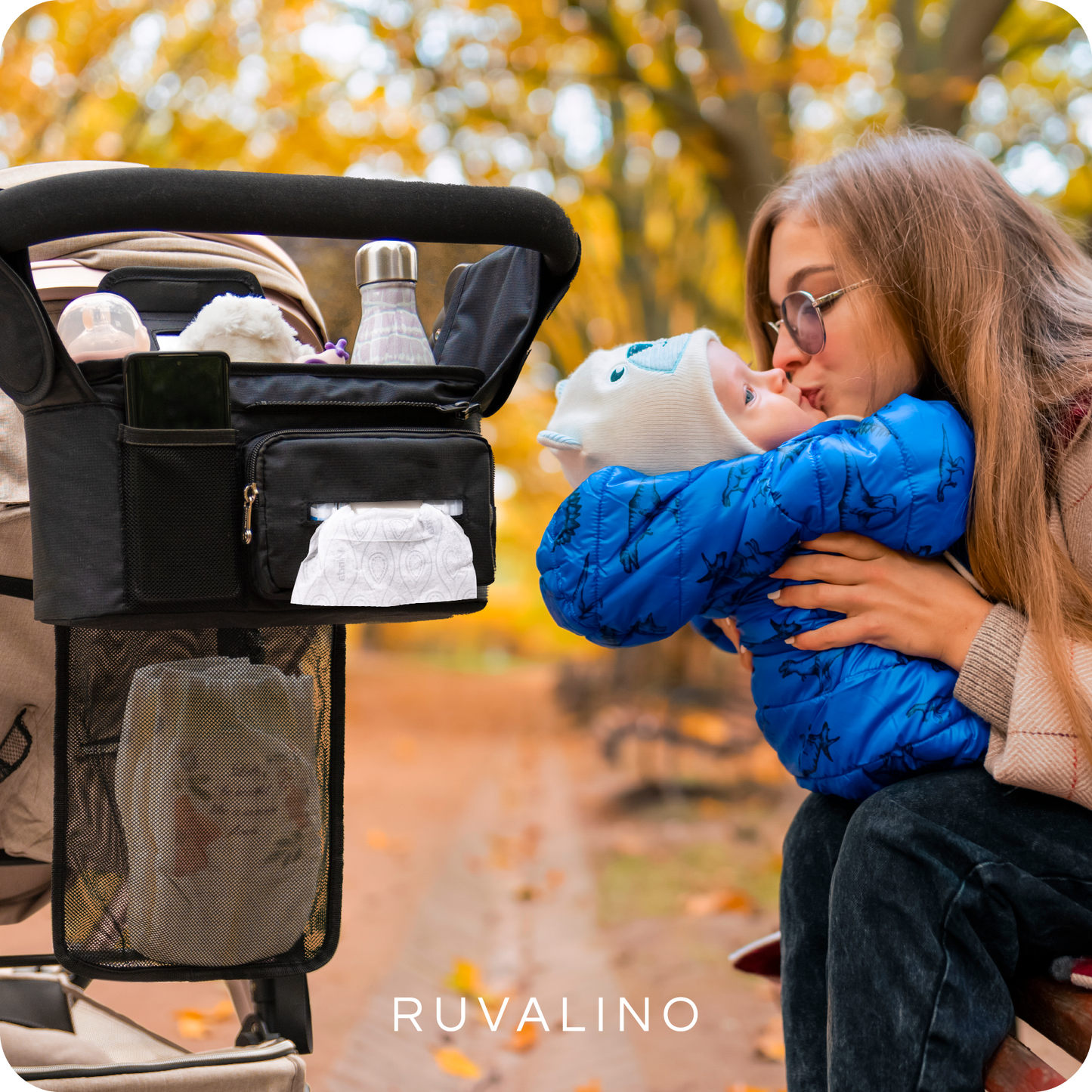 a person holding a baby with text: 'RUVALINO'