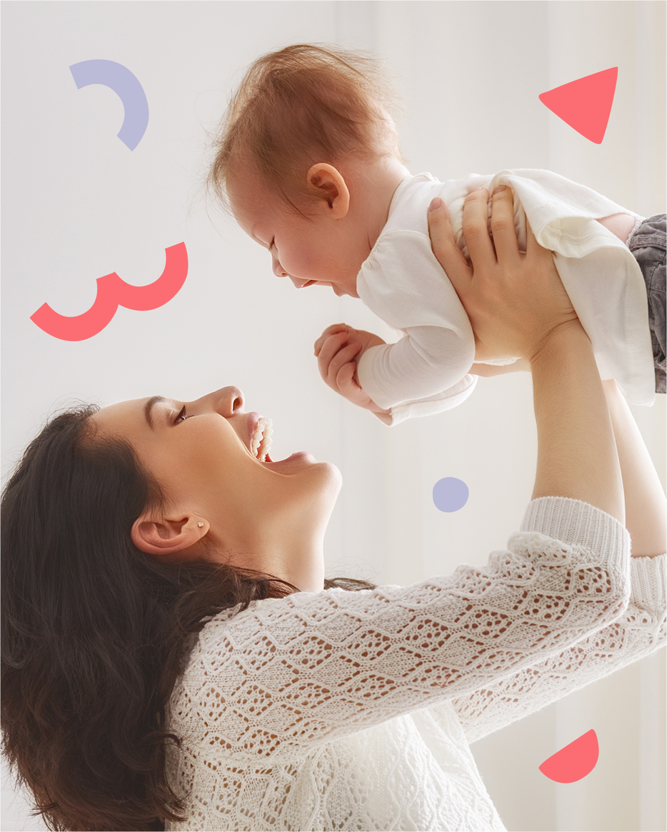 a happy mom picking up a happy baby with red and purple shapes floating in background 