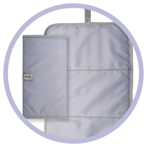 a closed up gray changing pad next to an open gray changing pad