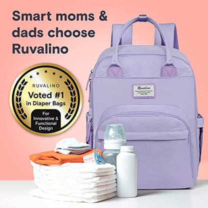 a purple backpack with baby items on a table with text: 'Smart moms & dads choose Ruvalino RUVALINO Voted #1 in Diaper Bags Fo Innovative & Functional Design'